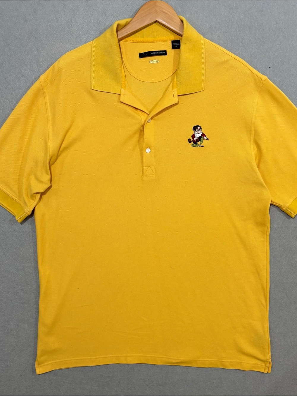 Greg Norman Collection Yellow Polo with Disney Golfing Dwarf